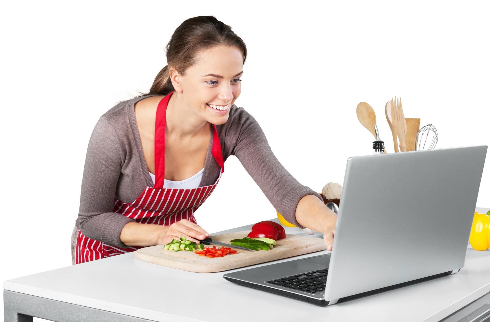 Student cooking at home following a laptop class